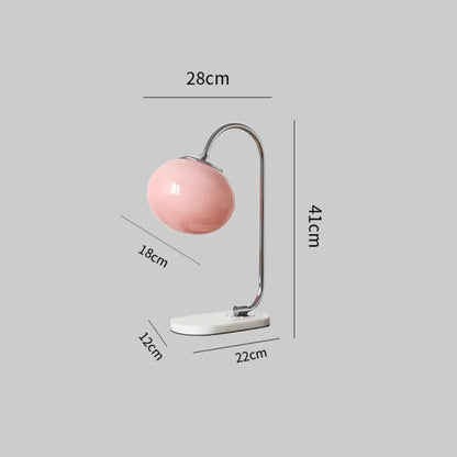 WeichesLeuchten: Elegante Tischlampe mit rundem Glas und sanftem, warmem Licht